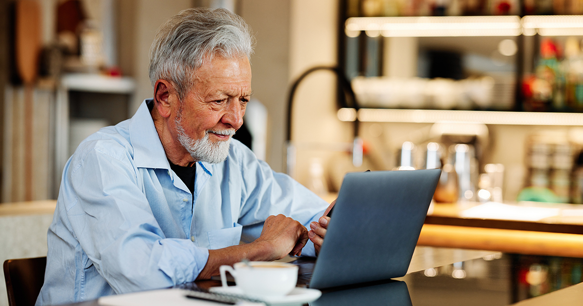 Man researching on laptop