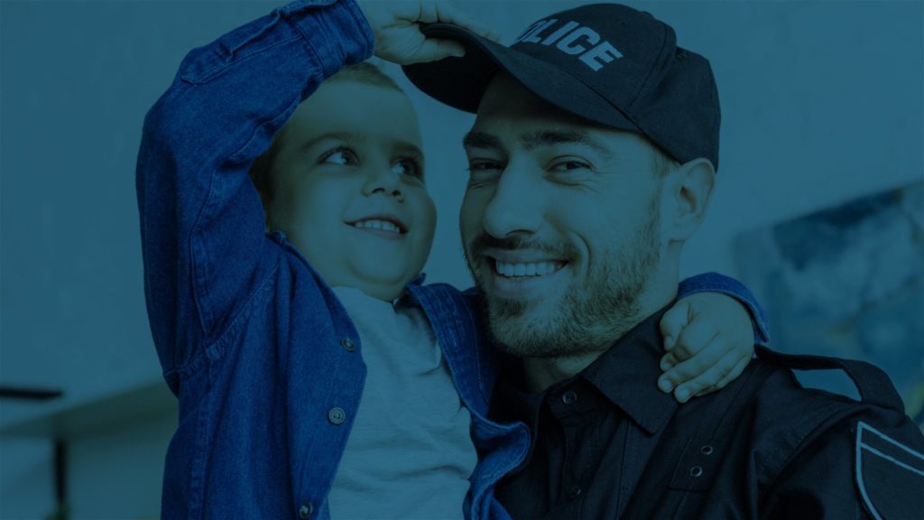 Policeman holding child