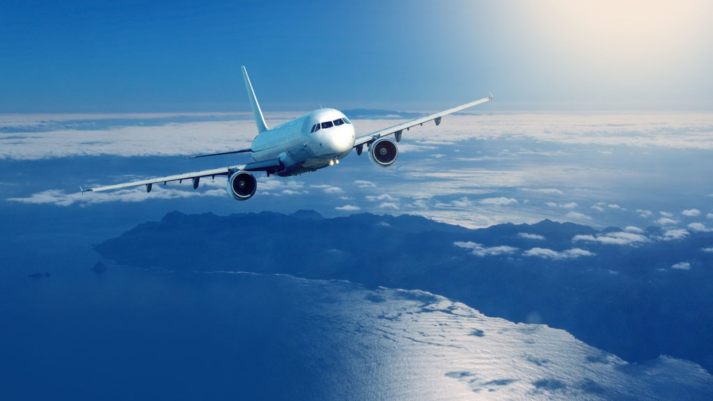 Plane flying over clouds