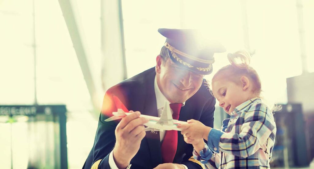 Airline pilot going through divorce plays with child