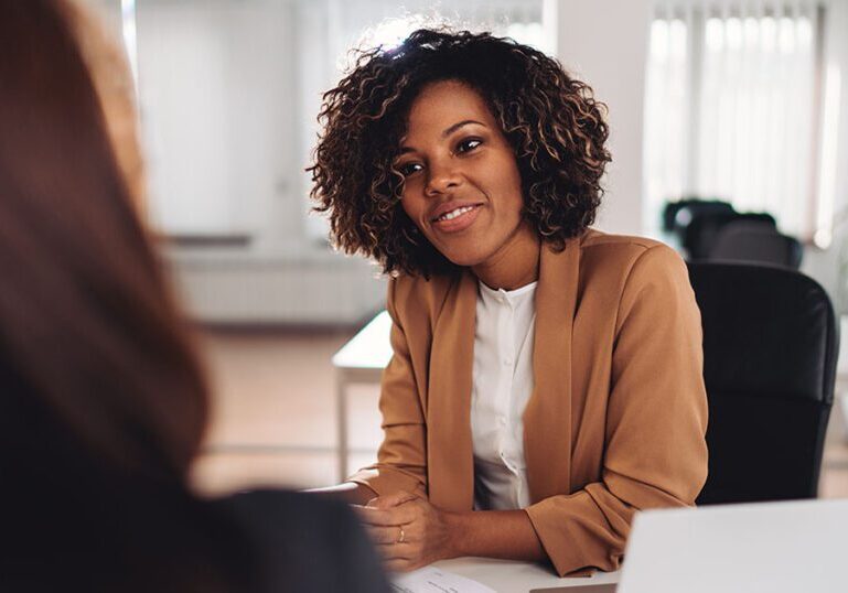 woman speaks to female estate planning attorney