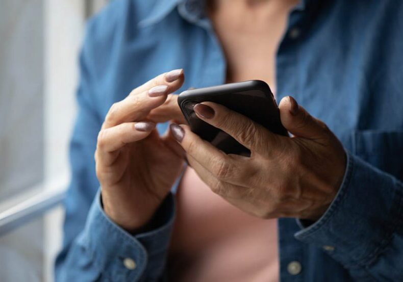 Woman uses her phone to create a legacy contact