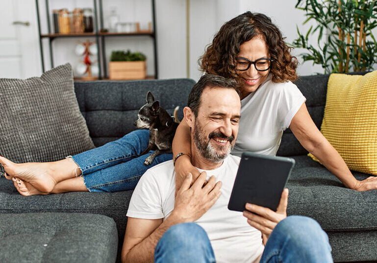 successful retirement savers reviewing their account balances online