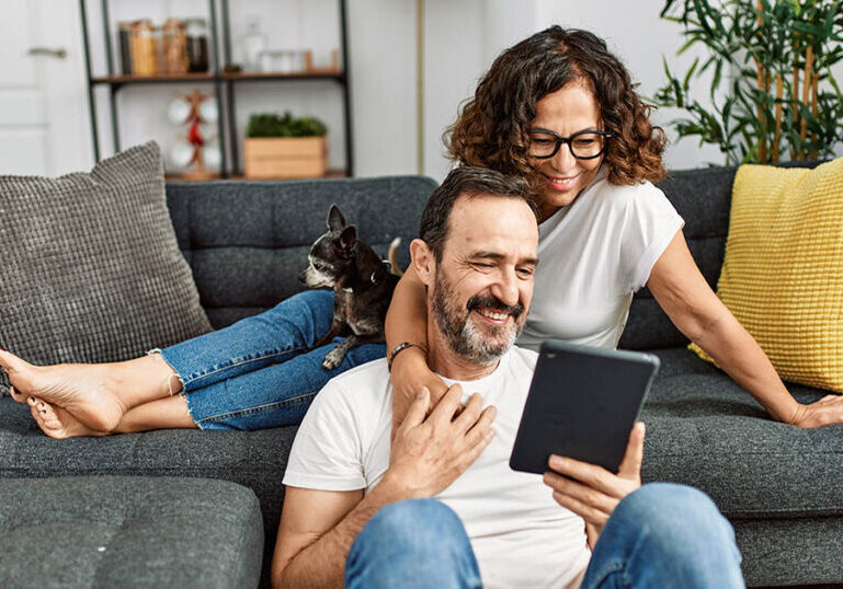 successful retirement savers reviewing their account balances online