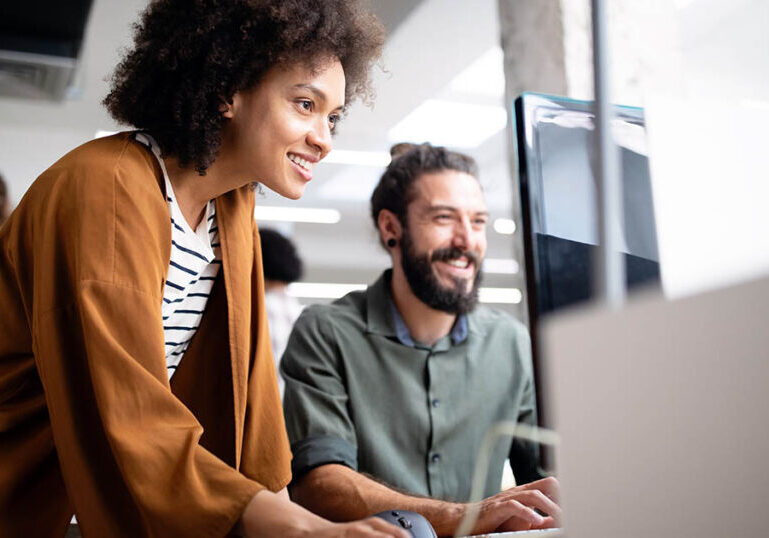 Happy workers consider their 401k benefits and how to maximize them