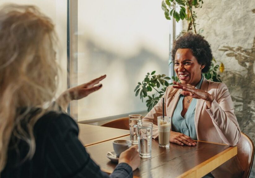 Two women having discussion at restaurant