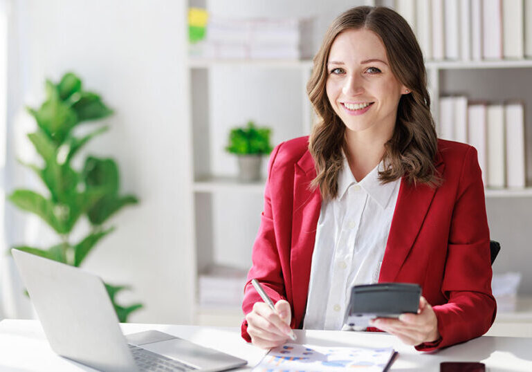 Business owner doing taxes at desk