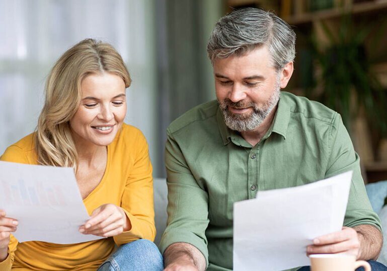 A couple reviews financial documents