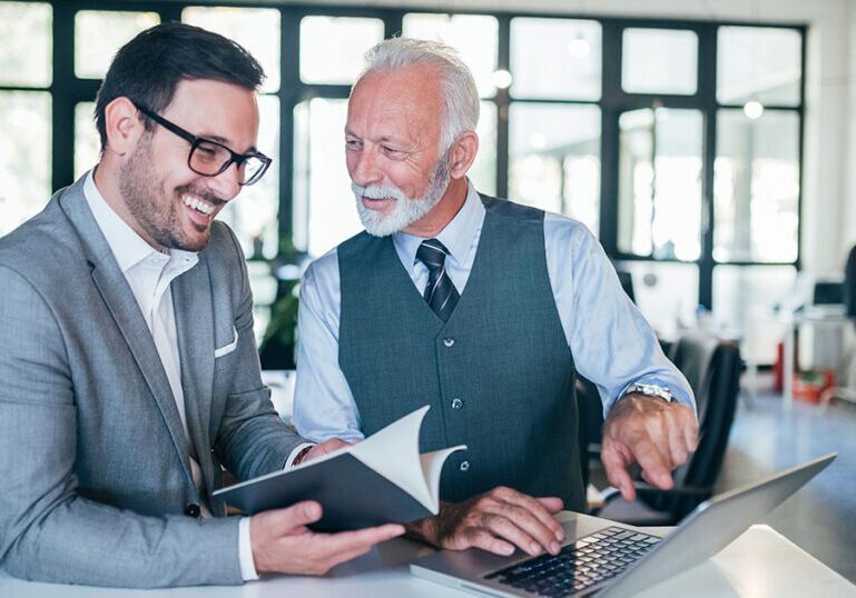 Business owner going over succession plan with colleague